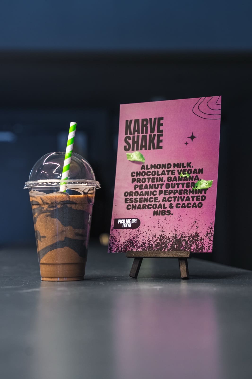 The KARVE Shake — chocolate vegan protein smoothie — beside its ingredient card at KARVE Café The KARVE Shake — chocolate vegan protein smoothie — beside its ingredient card at KARVE Café