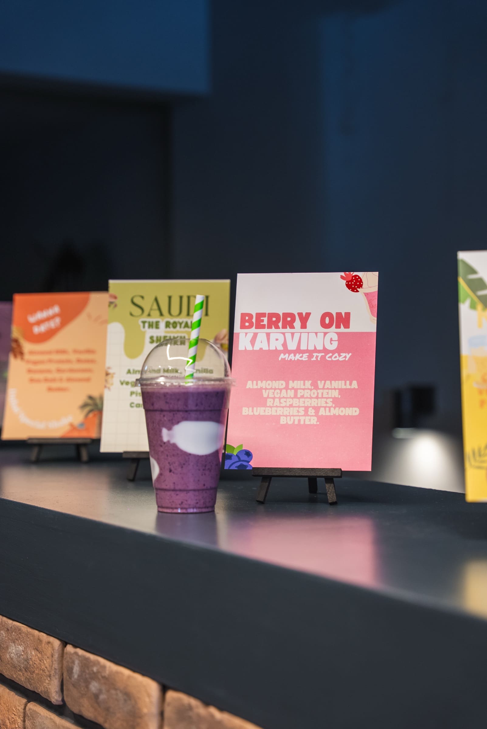 KARVE Café signature protein smoothies lined up with their ingredient cards KARVE Café signature protein smoothies lined up with their ingredient cards