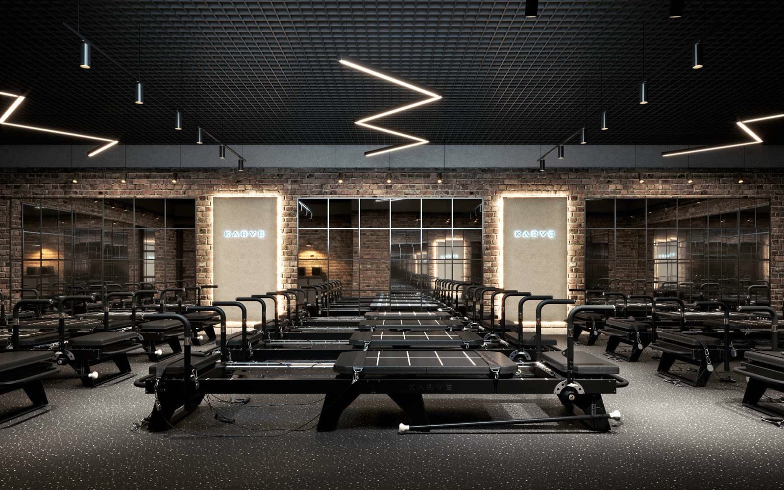 The KARVE Victoria studio floor — rows of Transformer machines under the signature lighting The KARVE Victoria studio floor — rows of Transformer machines under the signature lighting