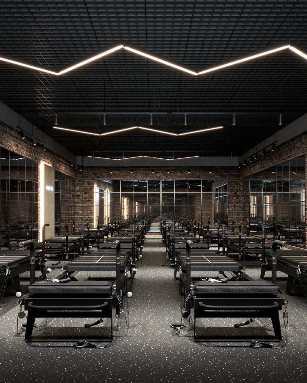 A KARVE studio floor lined with Transformer machines under low, directional light