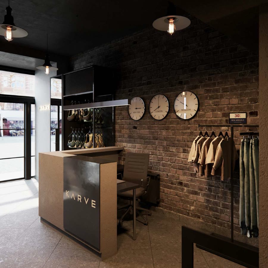 KARVE retail counter with branded apparel rails on exposed brick